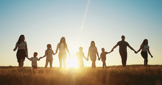 Family Holding Hands, Walking Into a Sunset — Midcoast Financial Planning Group in Tuncurry, NSW