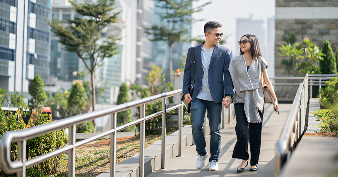 Couple Walking and Smiling — Midcoast Financial Planning Group in Tuncurry, NSW