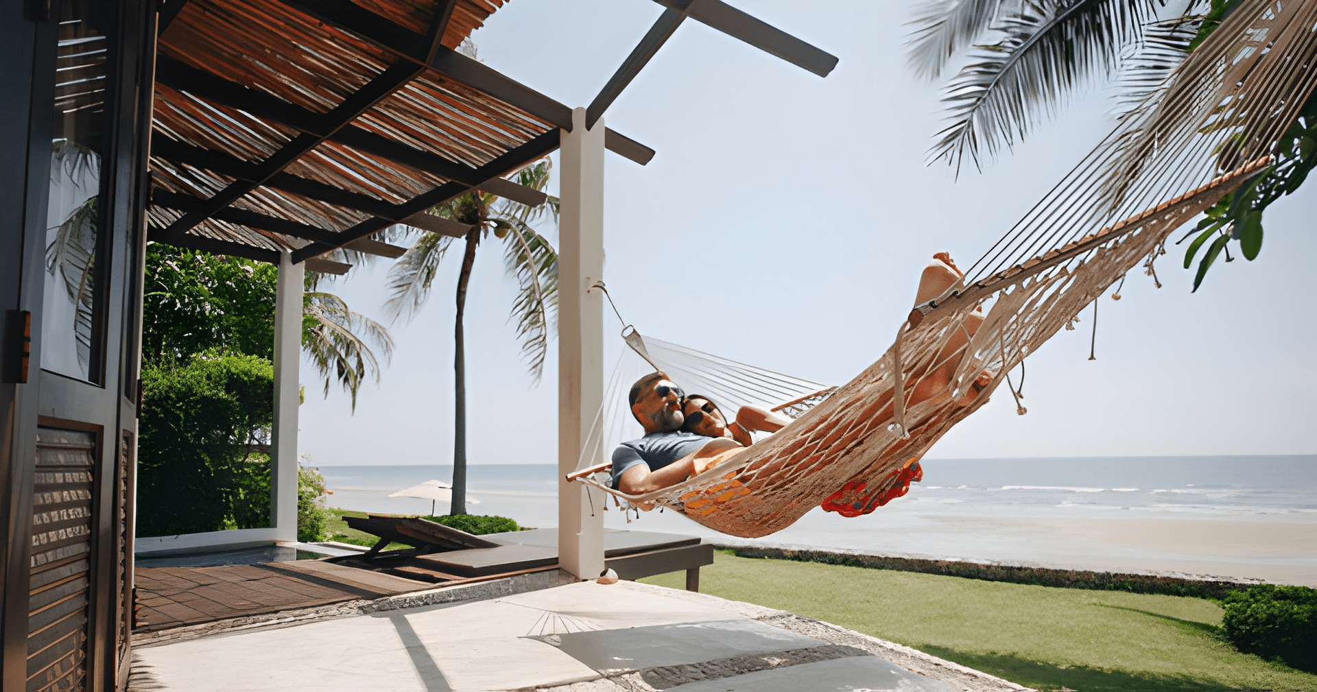 Couple Relaxing in Hammock on a Porch, Overlooking a Beach — Midcoast Financial Planning Group in Tuncurry, NSW