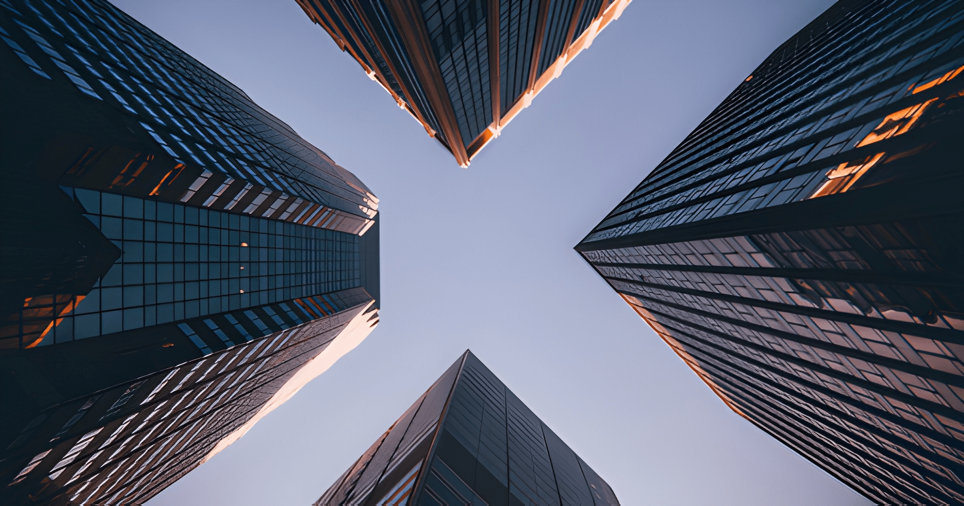 Four Skyscrapers Converge Towards the Sky, Blue and Orange Reflections on Glass — Midcoast Financial Planning Group in Tuncurry, NSW
