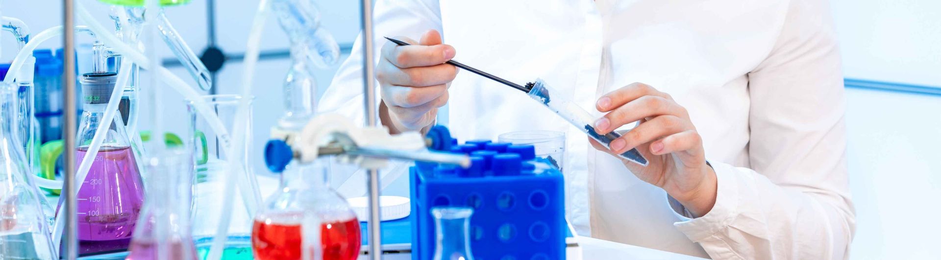 woman at laboratory examining soil sample