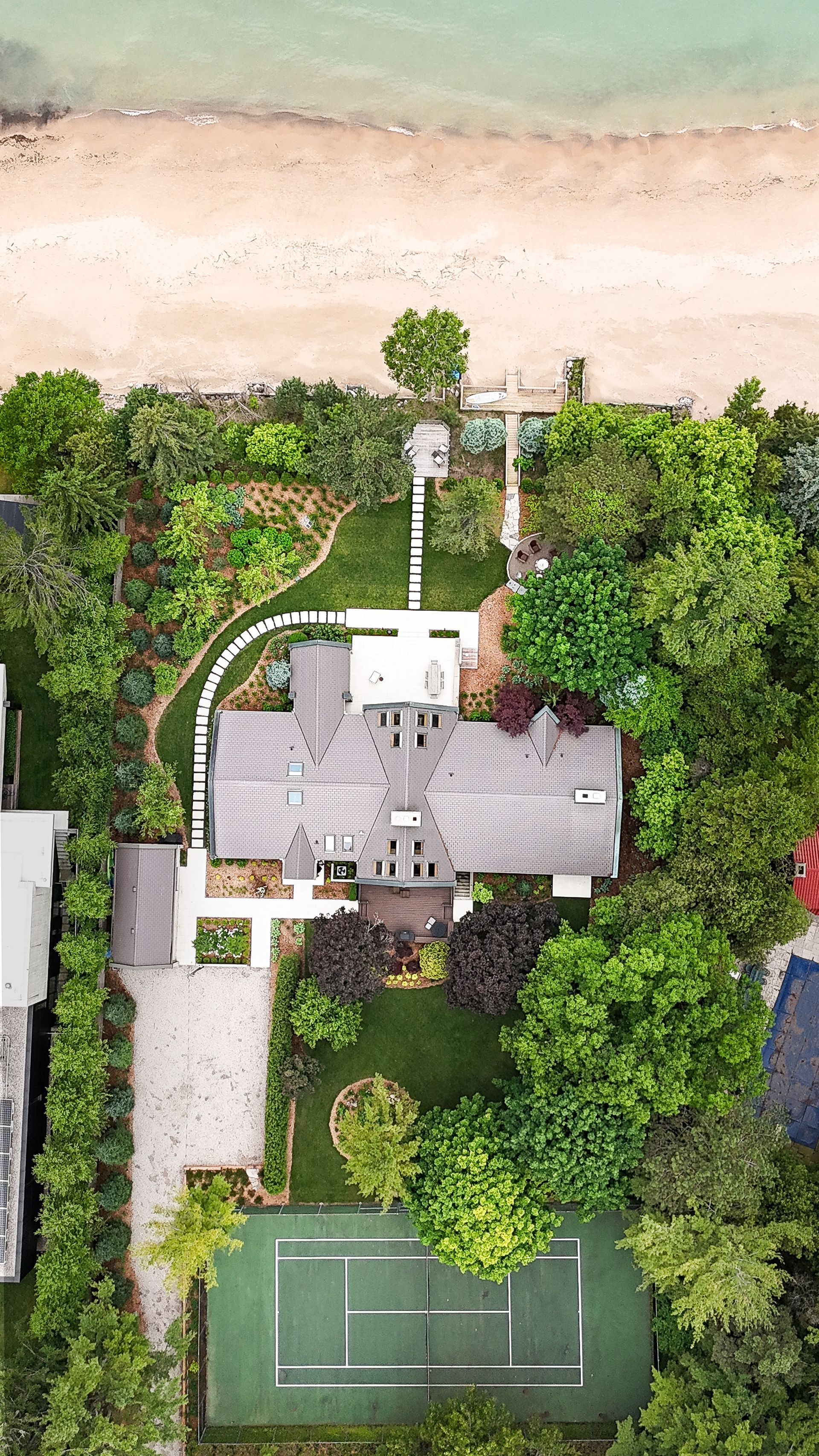 Aerial view of a beachside house by Lume Creative