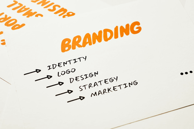 White page with orange “BRANDING” and a list: identity, logo, design, strategy, marketing.