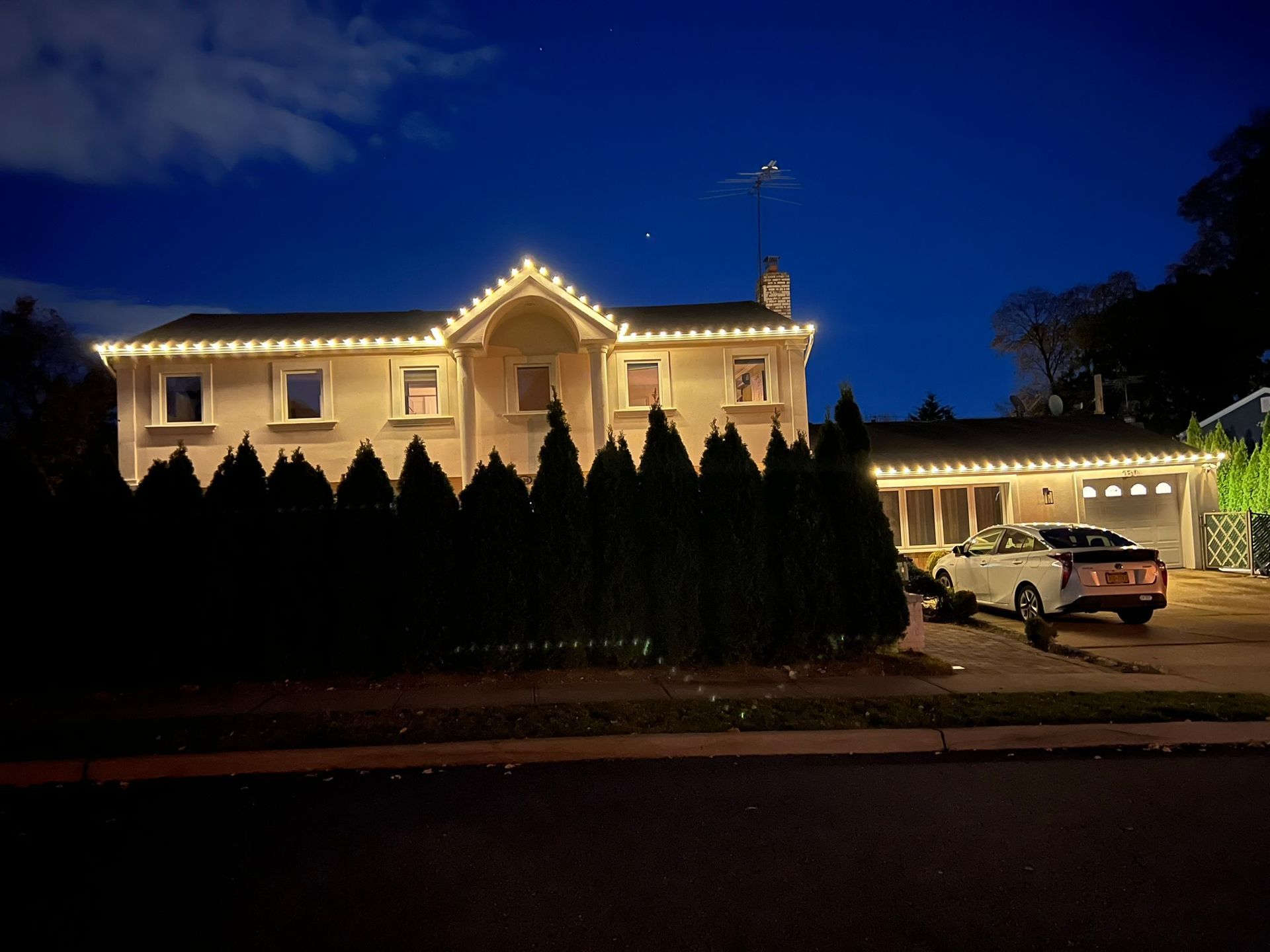 A house is lit up with christmas lights