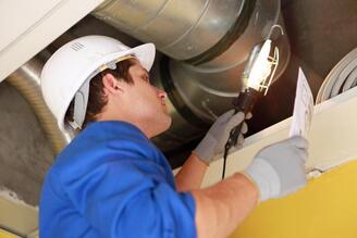 a technichian performing a duct cleaning in surprise arizona