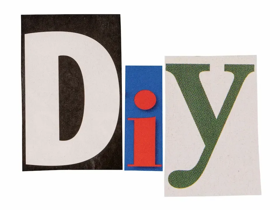Colorful cutout letters spelling “DIY” in black, red, blue, and green.
