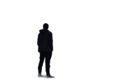 Silhouetted person standing alone against a white background