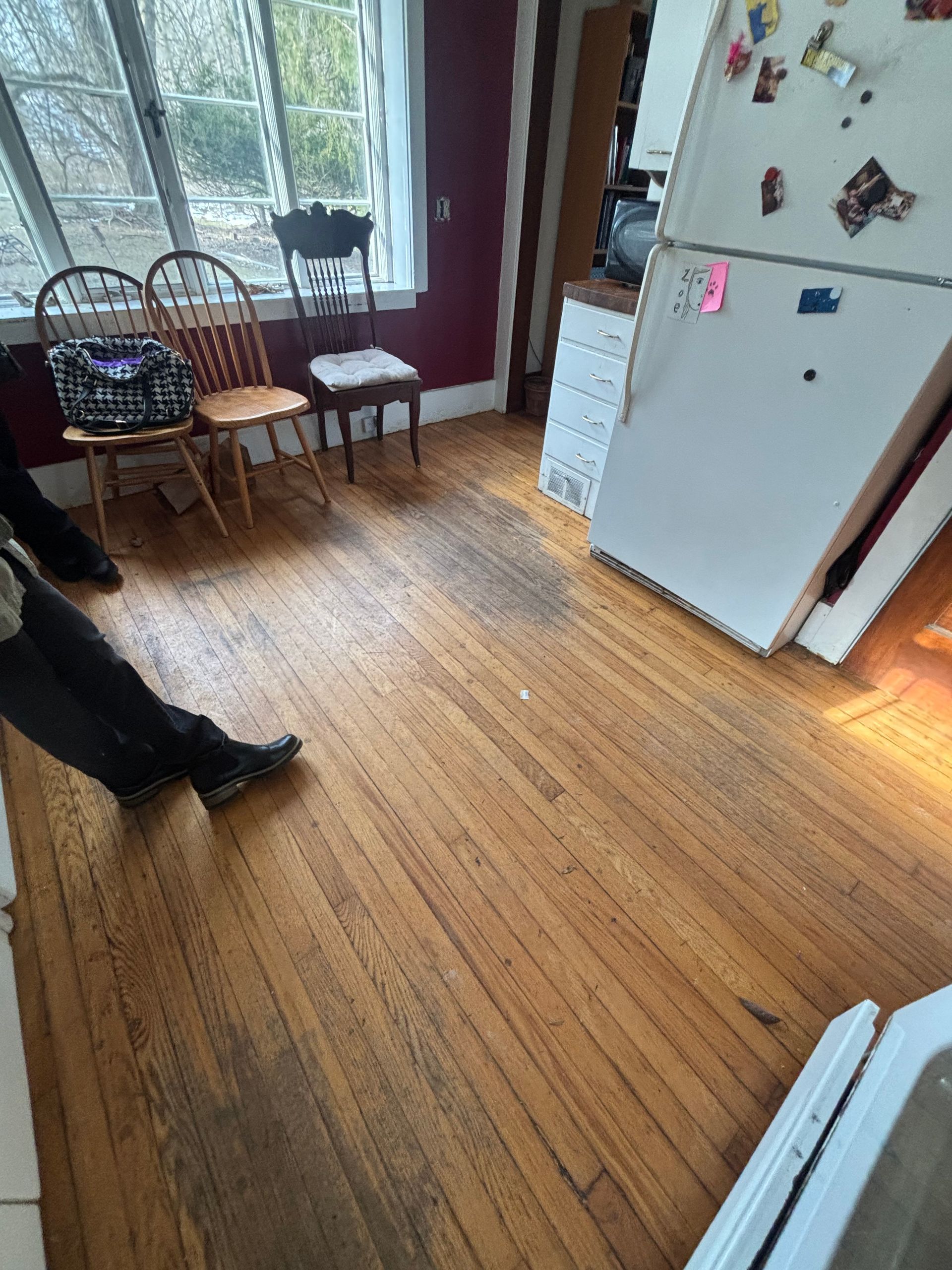 A kitchen with a yellow stove and a pink refrigerator