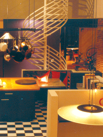 A kitchen with a spiral staircase and a checkered floor