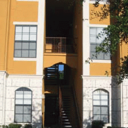 A building with stairs leading up to the second floor