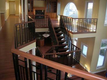 A large house with a spiral staircase leading up to the second floor