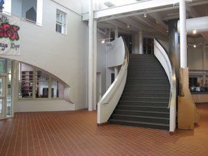 A building with stairs and a sign that says ' fox ' on it