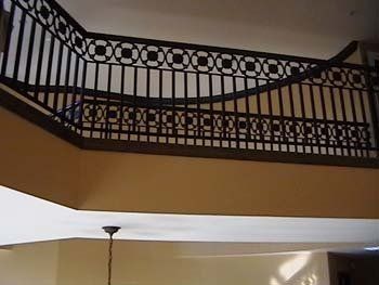 A staircase with a railing that looks like a bridge