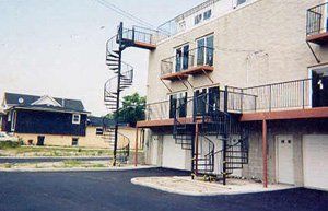 spiral stairs on the backside of an apartment