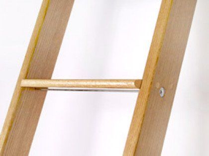 A close up of a wooden ladder on a white background.
