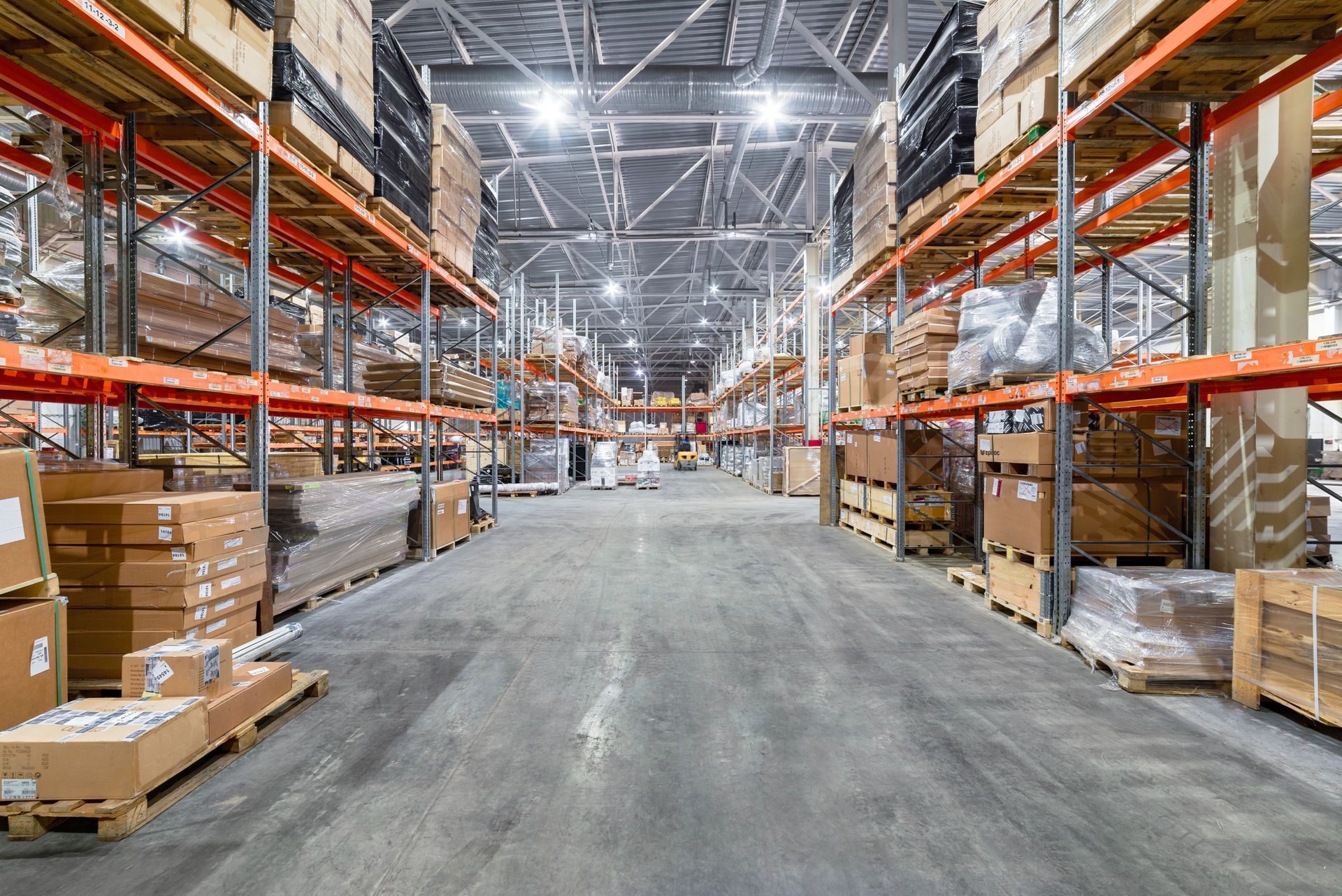 Warehouse interior with tall shelving packed with boxes and goods. — Australian Asset Compliance in Glanmire, QLD