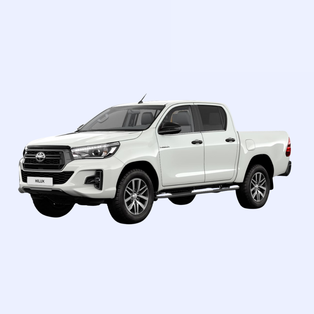 A white toyota hilux pickup truck on a white background.