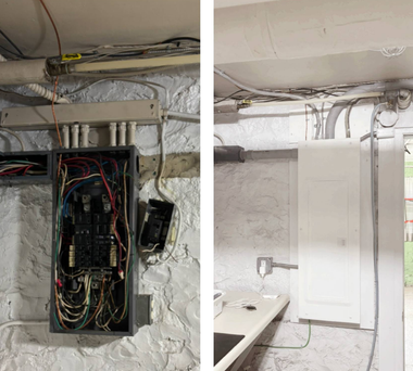 Open electrical panel and wall-mounted cabinet in a rough, unfinished basement with exposed wiring.