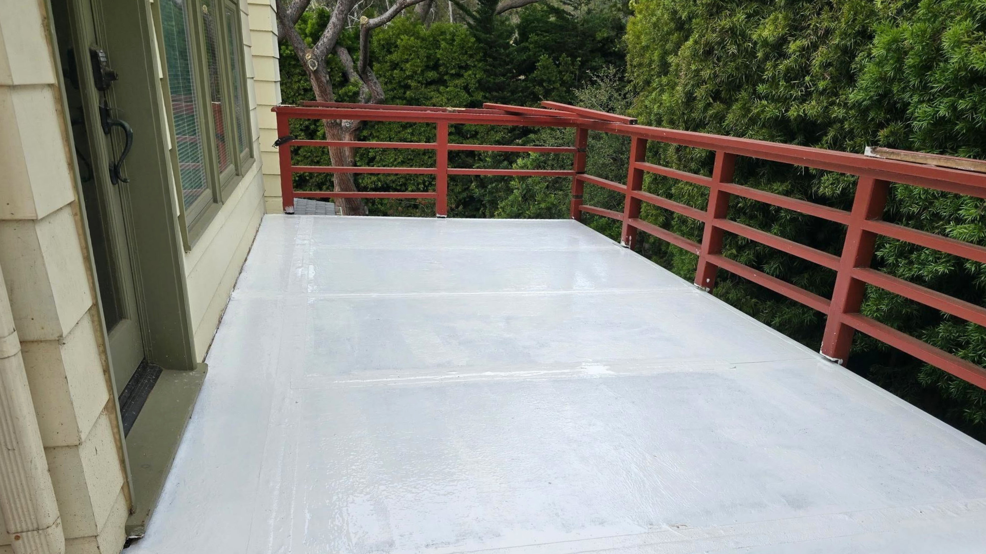 Freshly finished concrete driveway curing outside a Southern California home