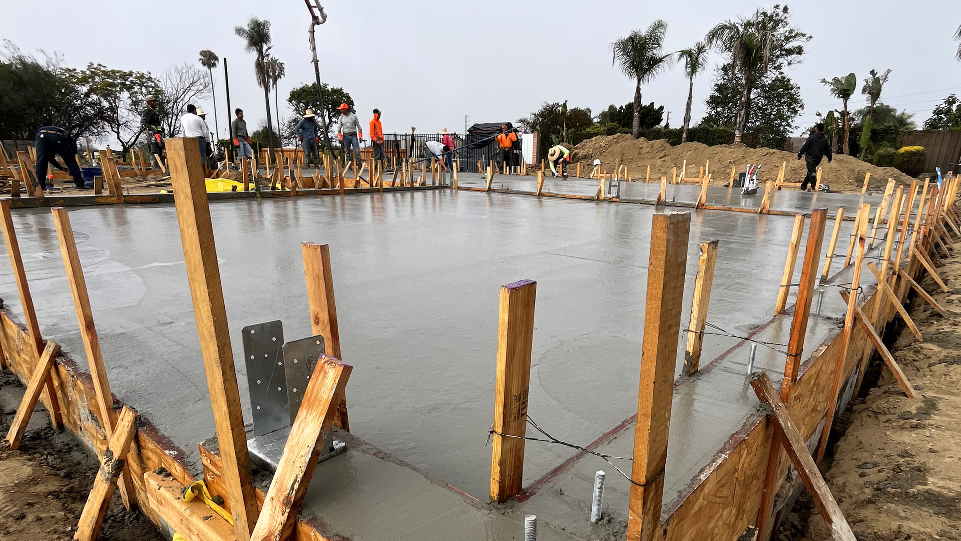 Fresh concrete slab curing under bright sun in a Southern California inland valley