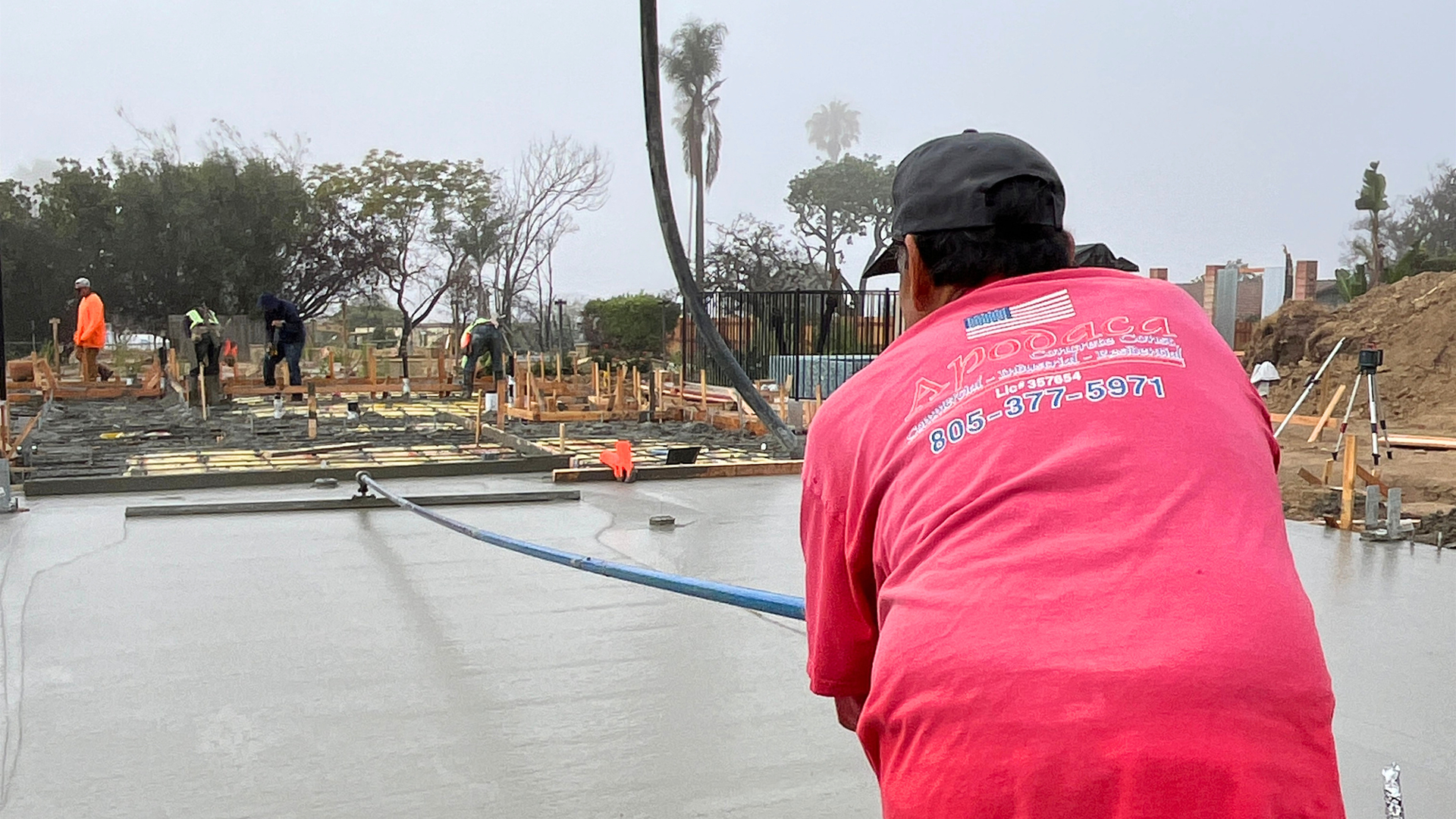 Concrete contractor reviewing site plans before starting a Thousand Oaks project