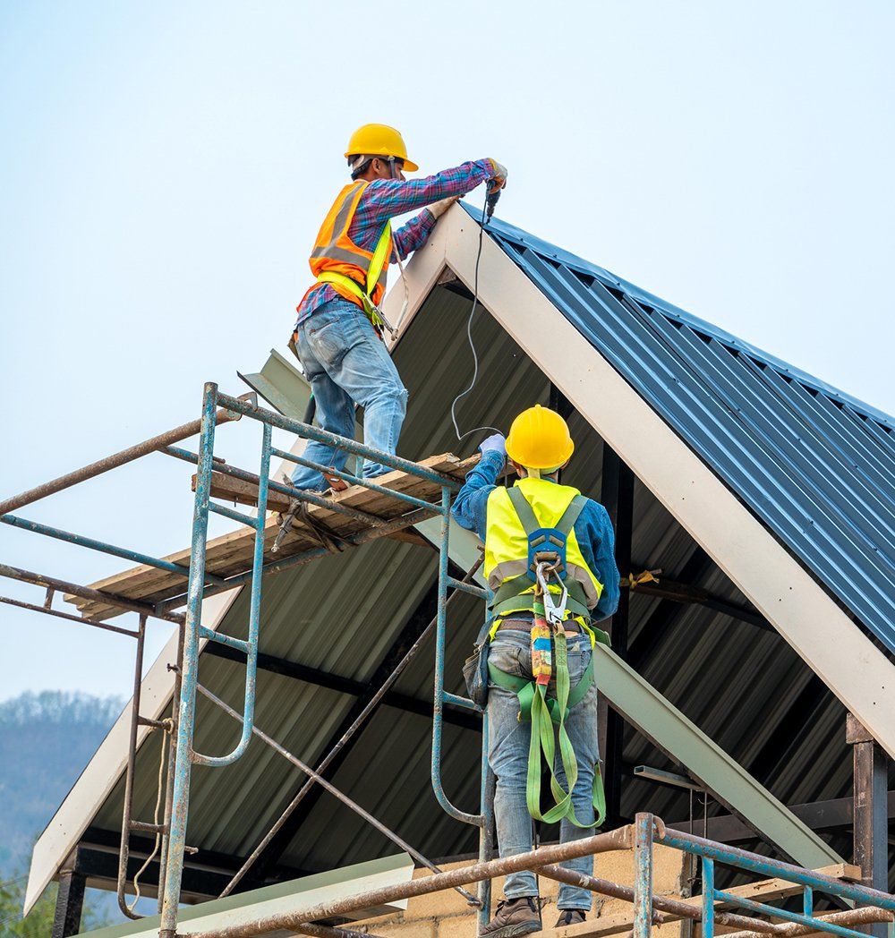 Two Men Installing A Roof — Bird In Hand, PA — Fisher Construction, Inc Two Men Installing A Roof — Bird In Hand, PA — Fisher Construction, Inc