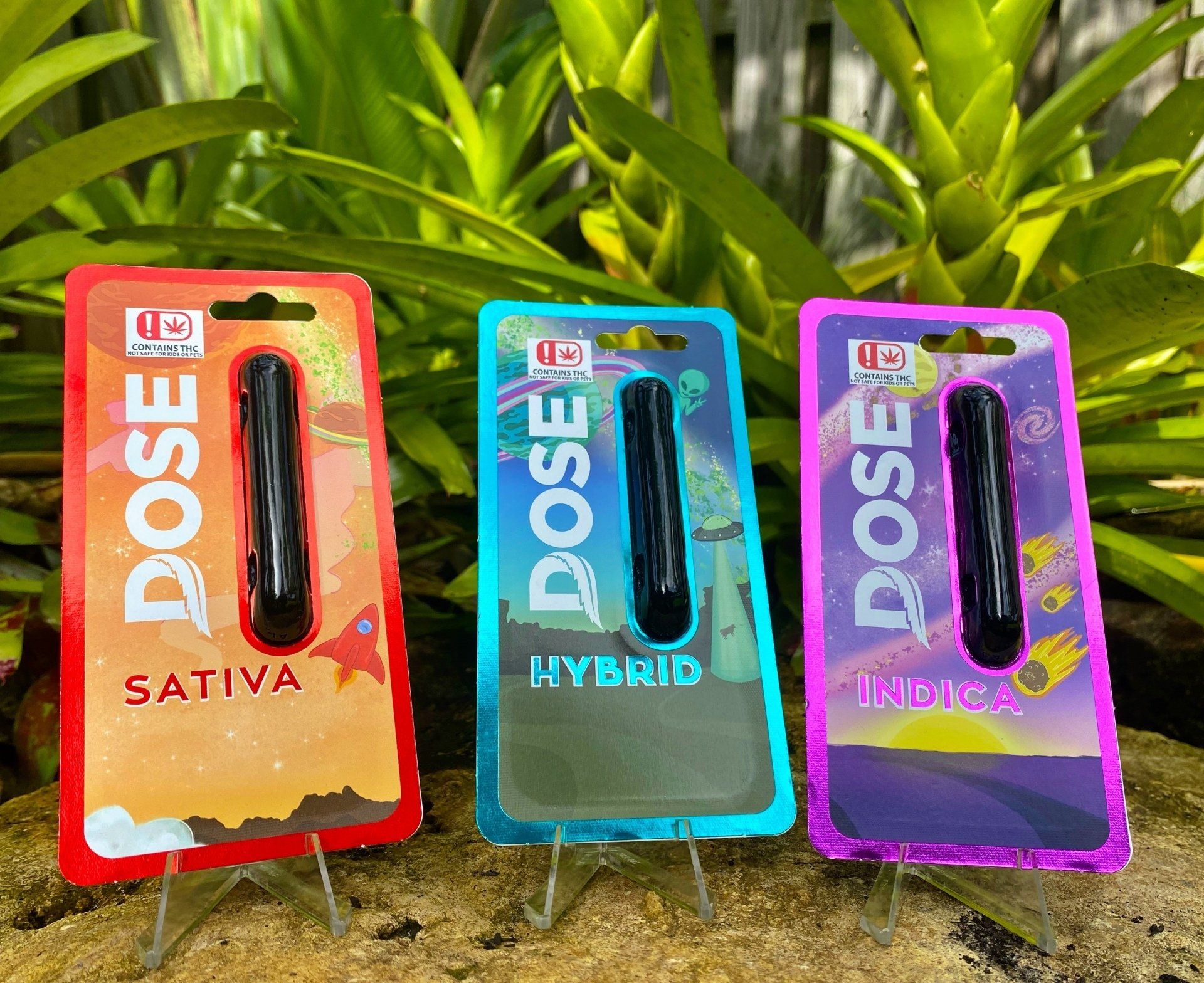 Three packages of dose sativa hybrid and hybrid cigarettes are sitting on a table.