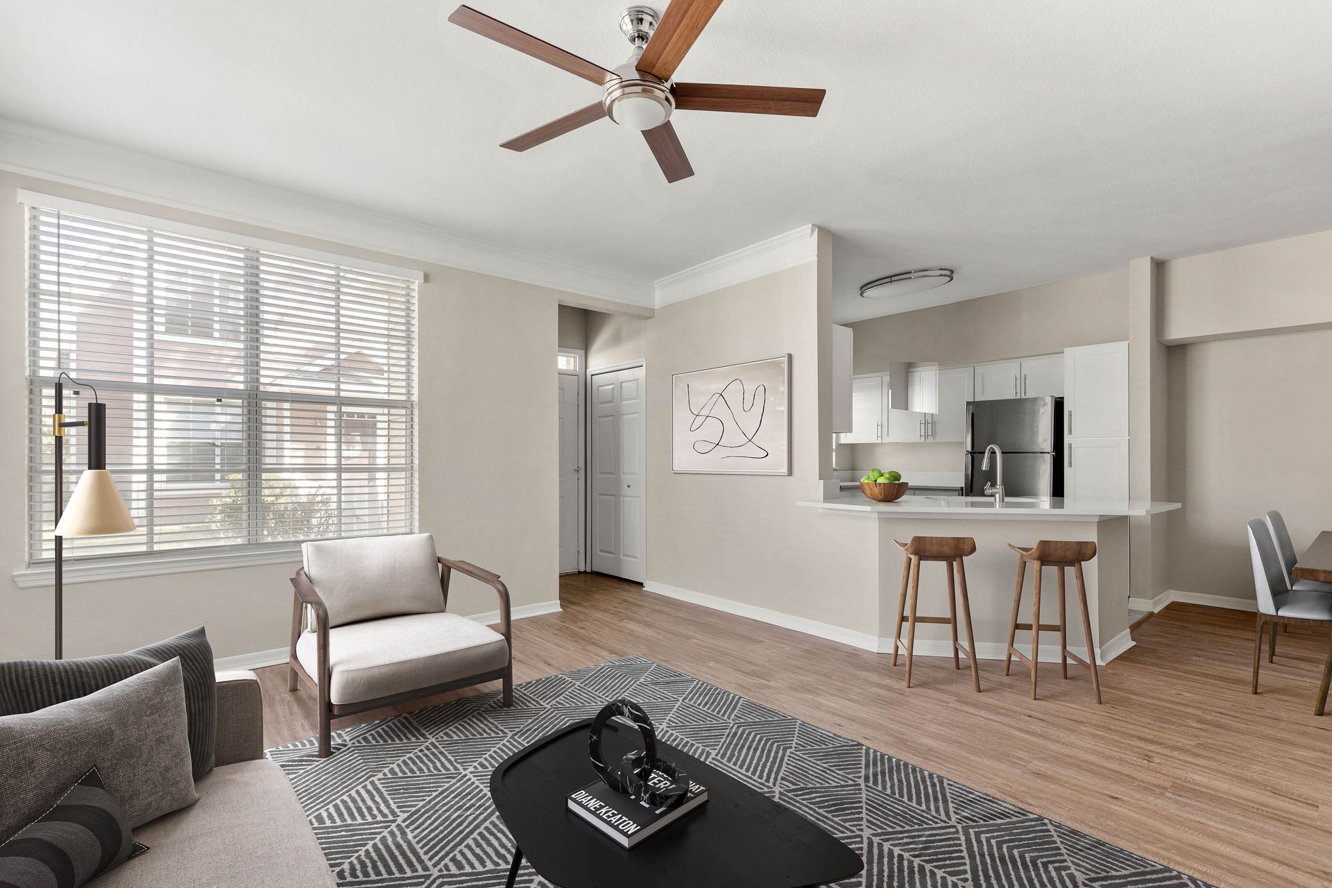 Living Room with Ceiling Fan at Burano Hunter's Creek Apartment