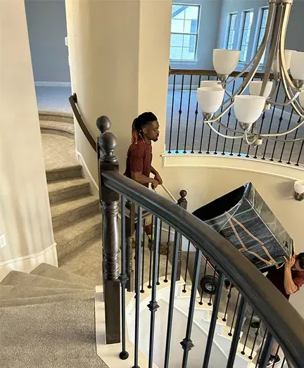 Man in stair holdin