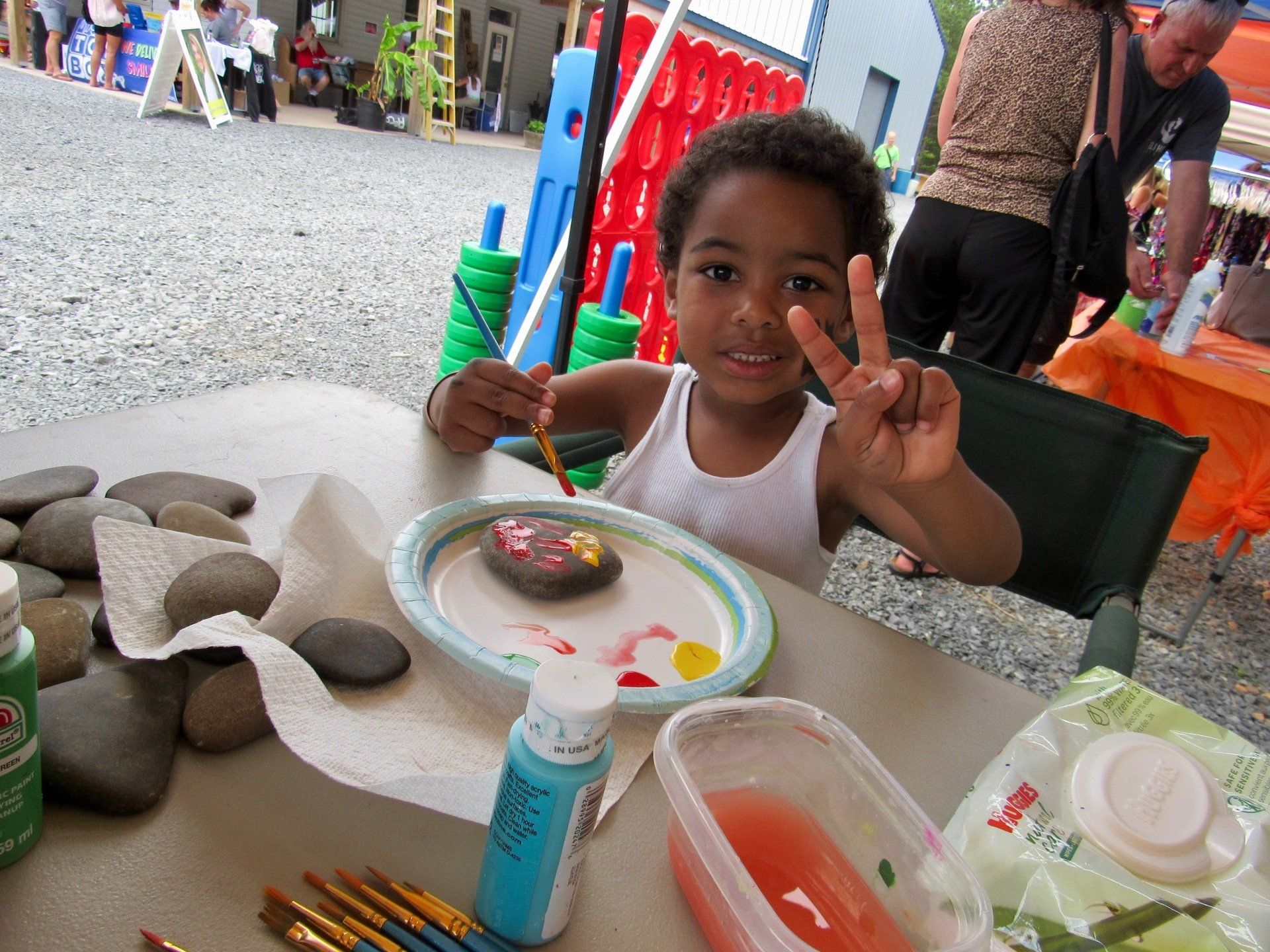Alvion, young boy painting.