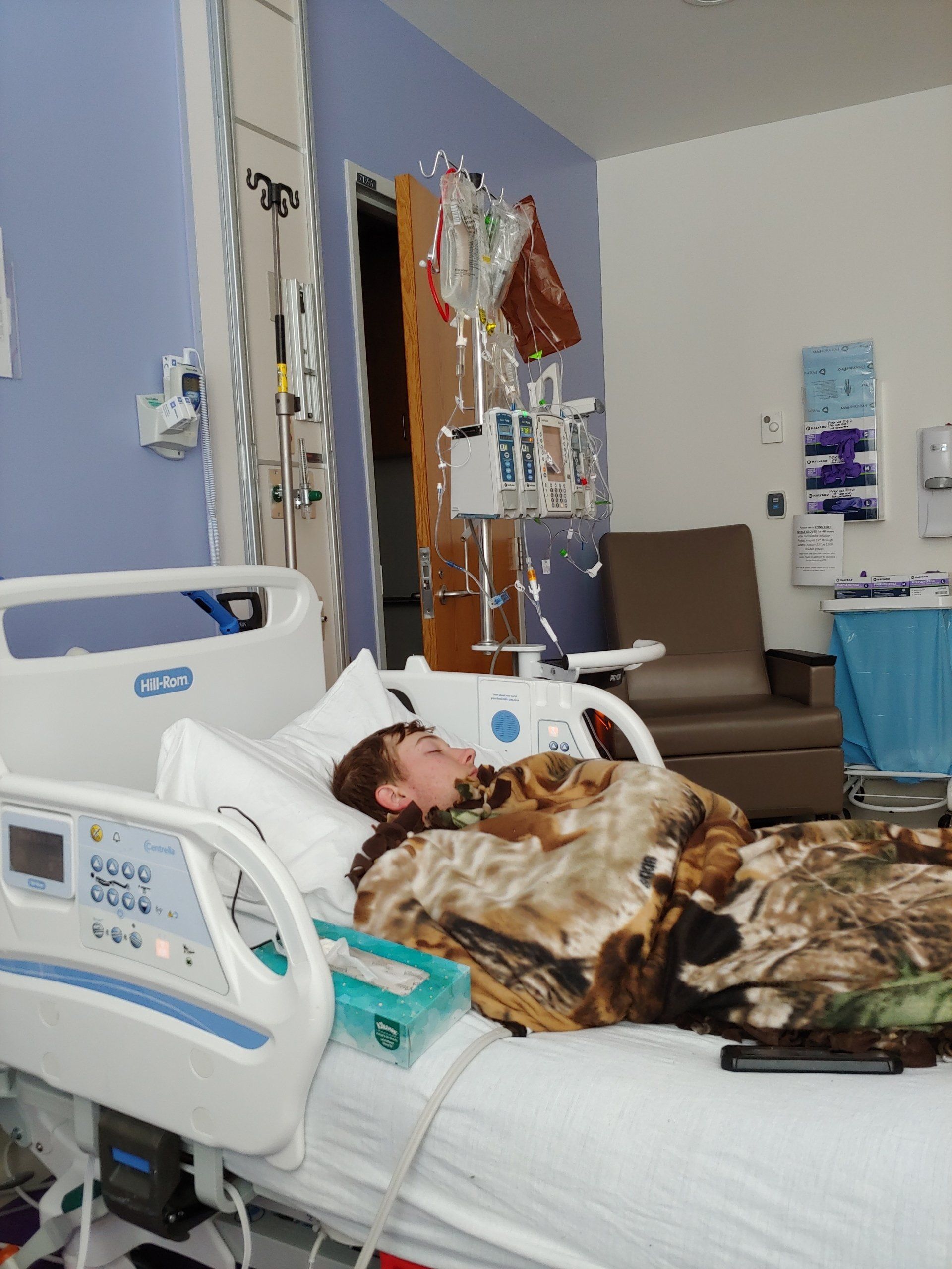 boy preparing for stem cell transplant in hospital room.