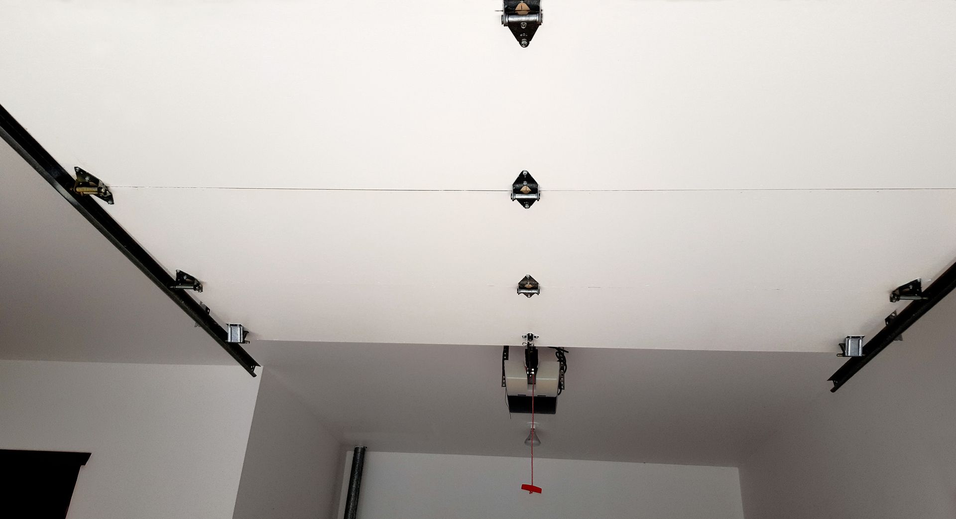 A white ceiling with a chandelier hanging from it