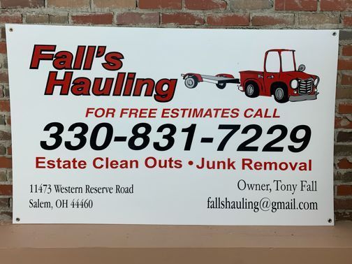 a sign that says fall 's hauling for free estimates call 330-831-7229
