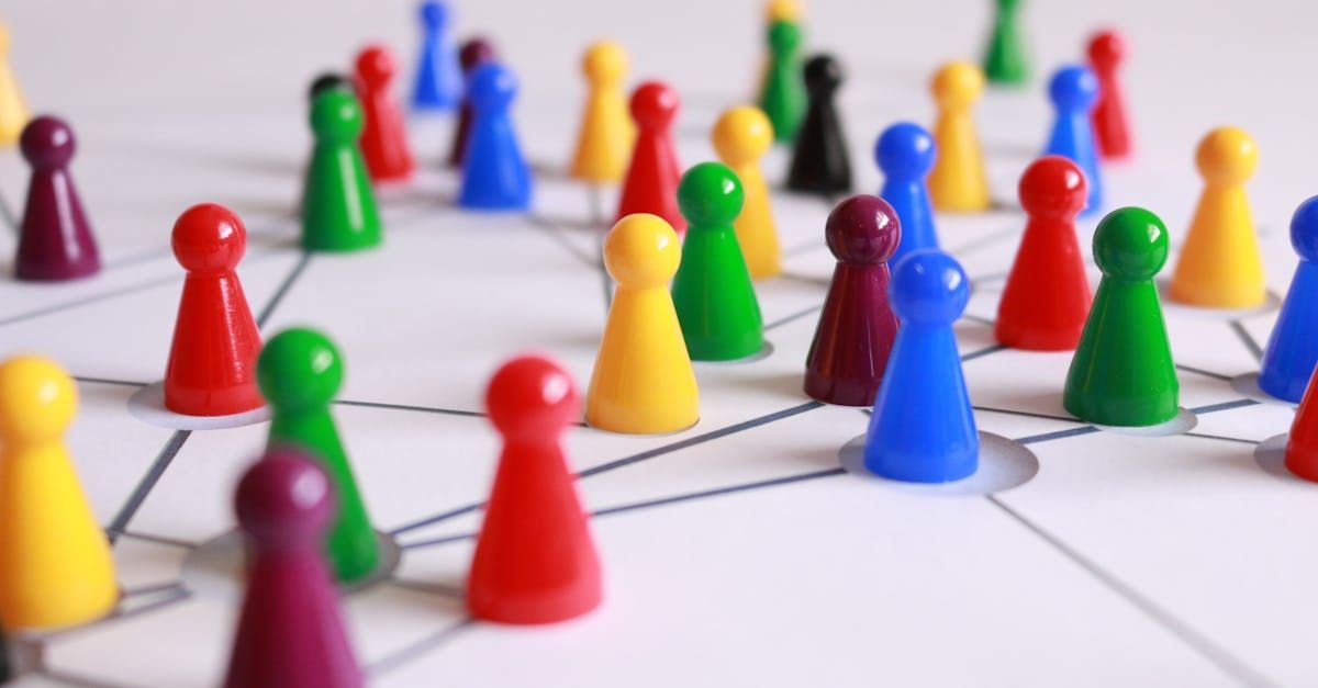 A bunch of colorful chess pieces are connected to each other on a board.
