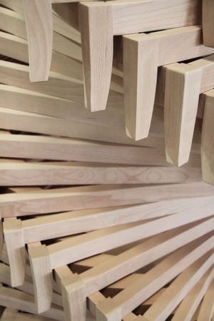 Stacked beige wooden planks in a close-up abstract pattern