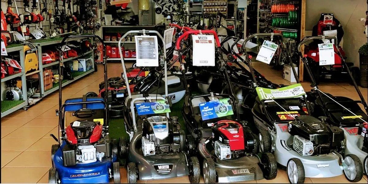 A Bunch of Lawn Mowers Are on Display in a Store — Diamond Service Centre In Lismore, NSW