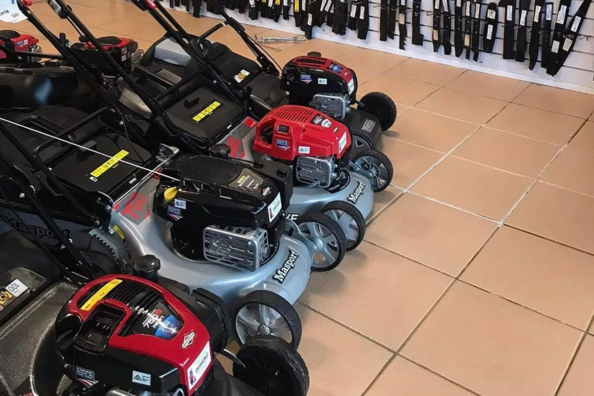 A Row of Lawn Mowers Are Lined Up in a Store — Diamond Service Centre In Lismore, NSW