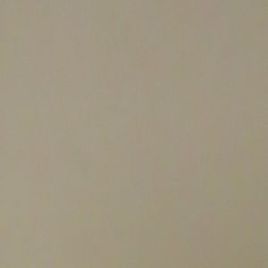 Blank beige wall background with slight shadowing
