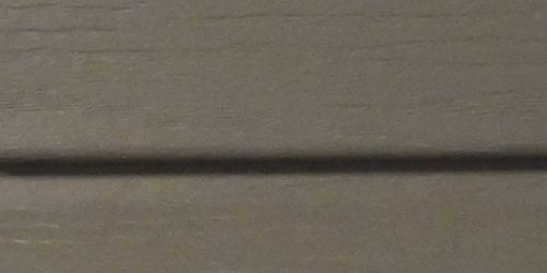 Close-up of clay vinyl siding. 