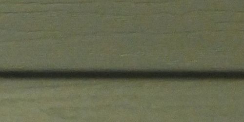 Close-up of sage vinyl siding. 