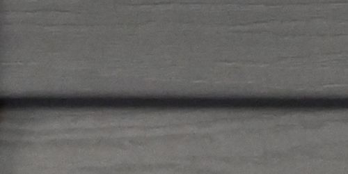 Close-up of slate vinyl siding. 