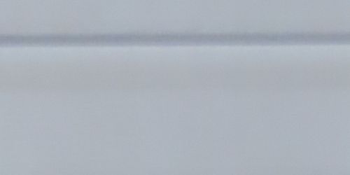 Close-up of white vinyl siding. 