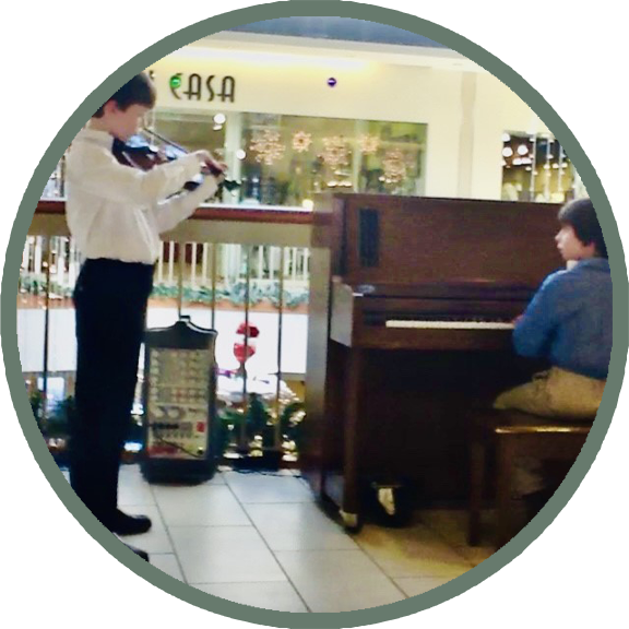 boys playing violin and piano
