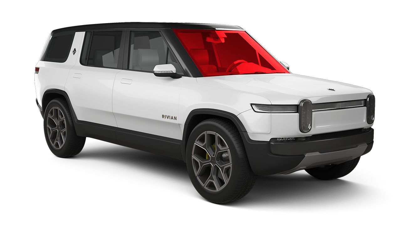White electric SUV in side view with black roof, dark wheels, and a red-tinted windshield on a white background