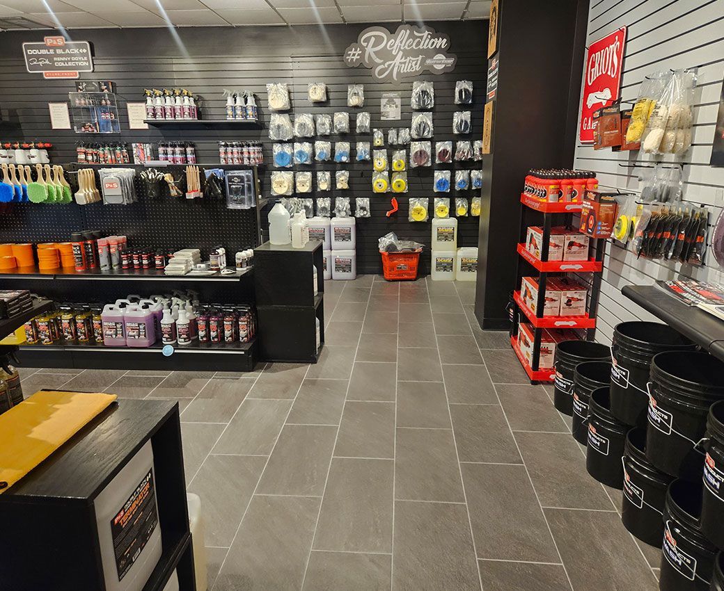 A store with a lot of shelves and buckets on the floor