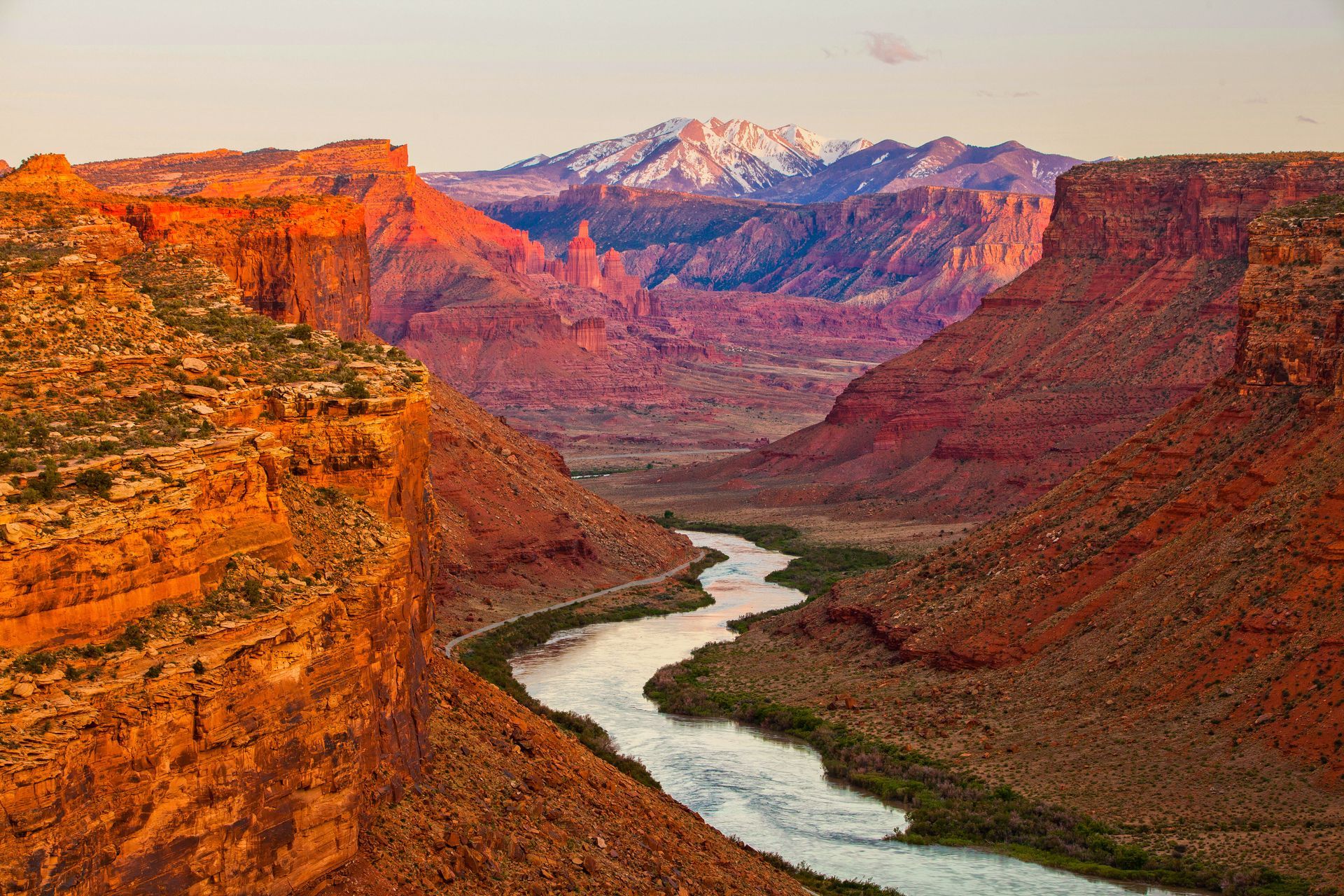 A river running through a canyon with mountains in the background.