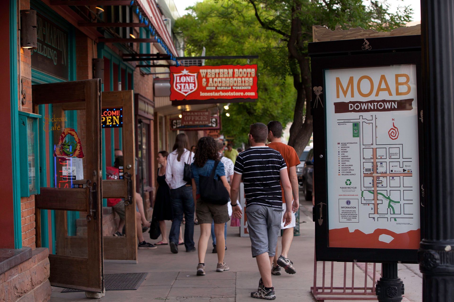 Visitors walk down main street shopping in Moab