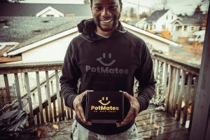 Man holding a box and wearing a 