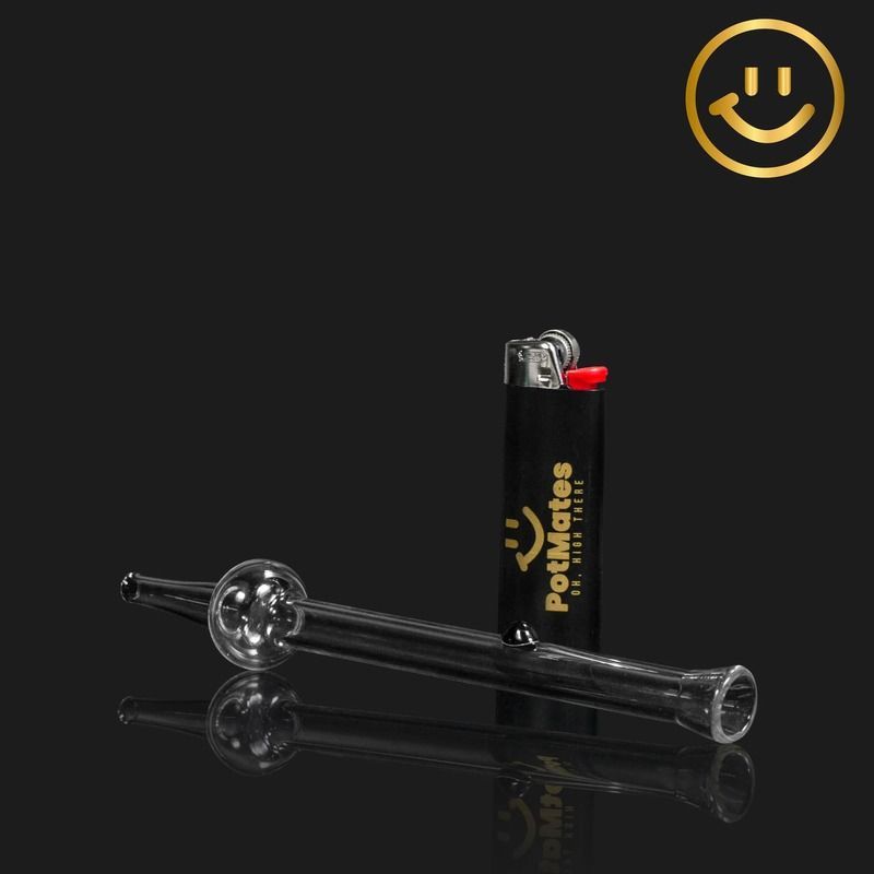 Black smoking pipe and lighter on a glossy black surface with a yellow smiley logo.