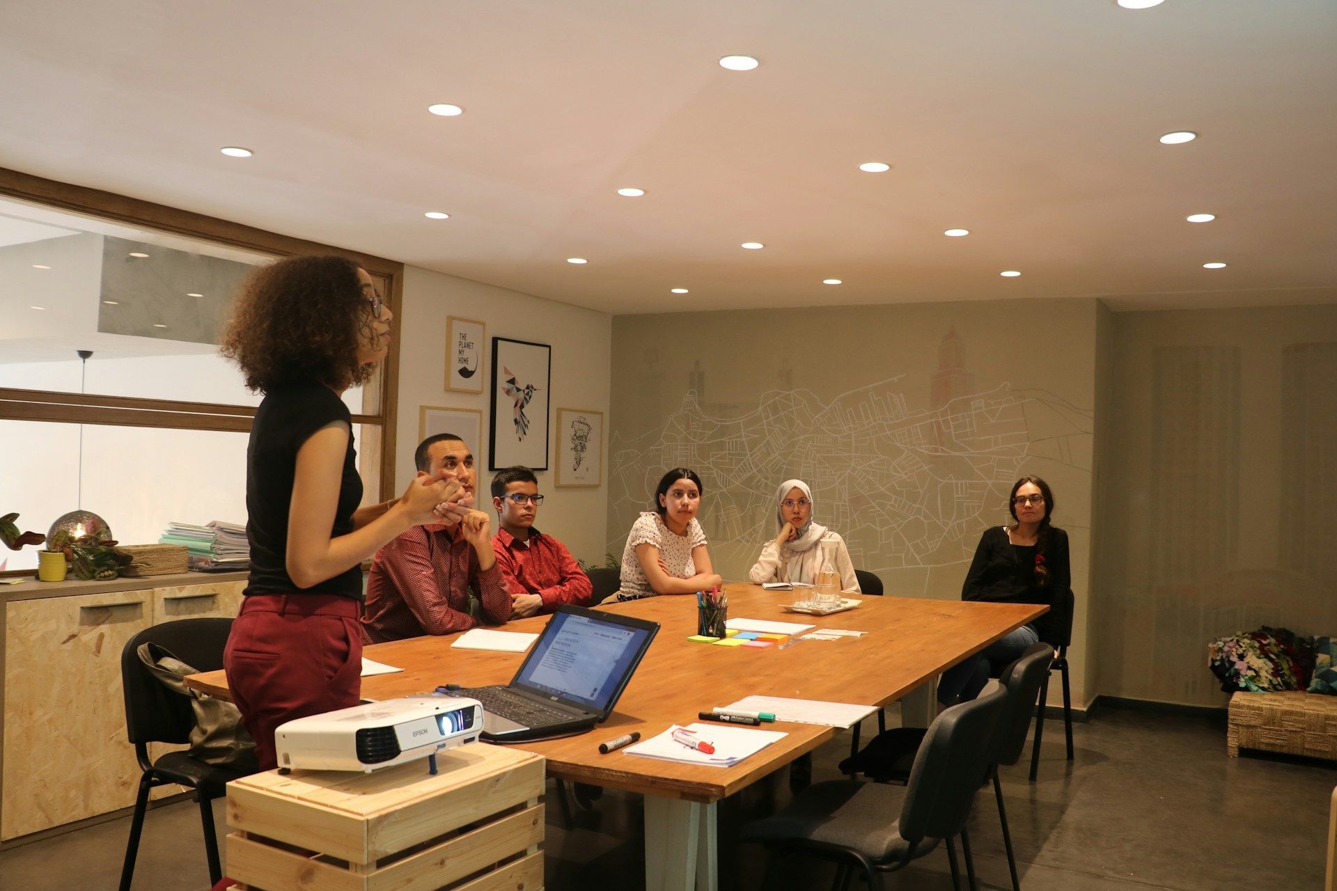 People at work doing learning and PD in group session facilitated workshop